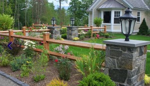 Landscaping-with-Wood-Fence-and-Stone-Posts